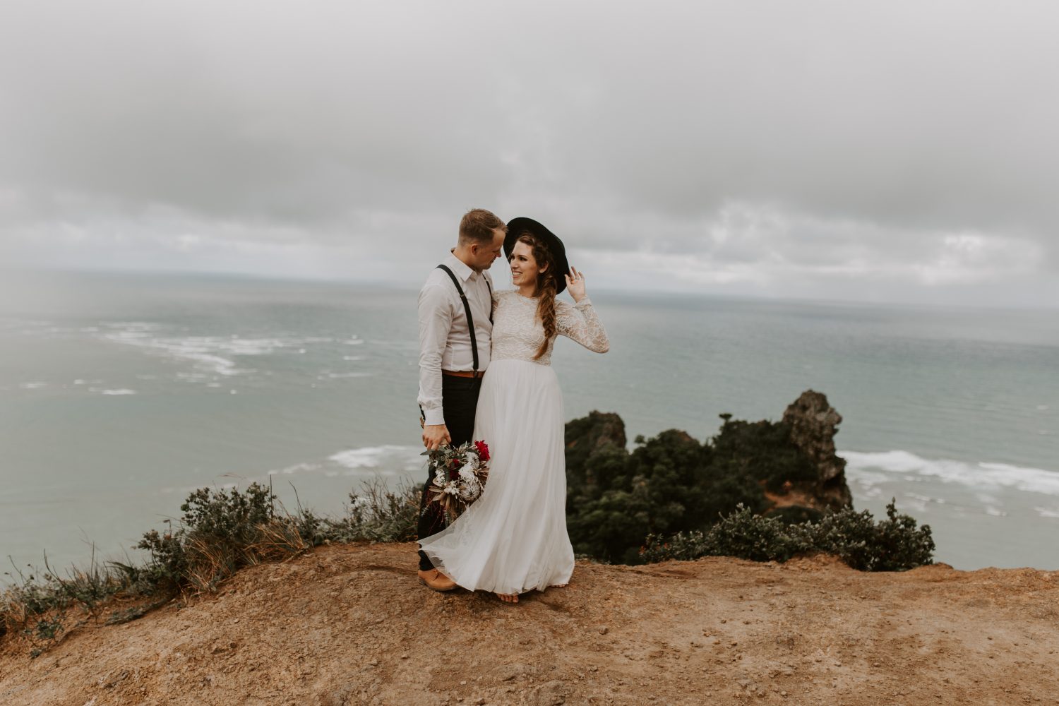 Moody cliffside elopement in Oahu Hawaii