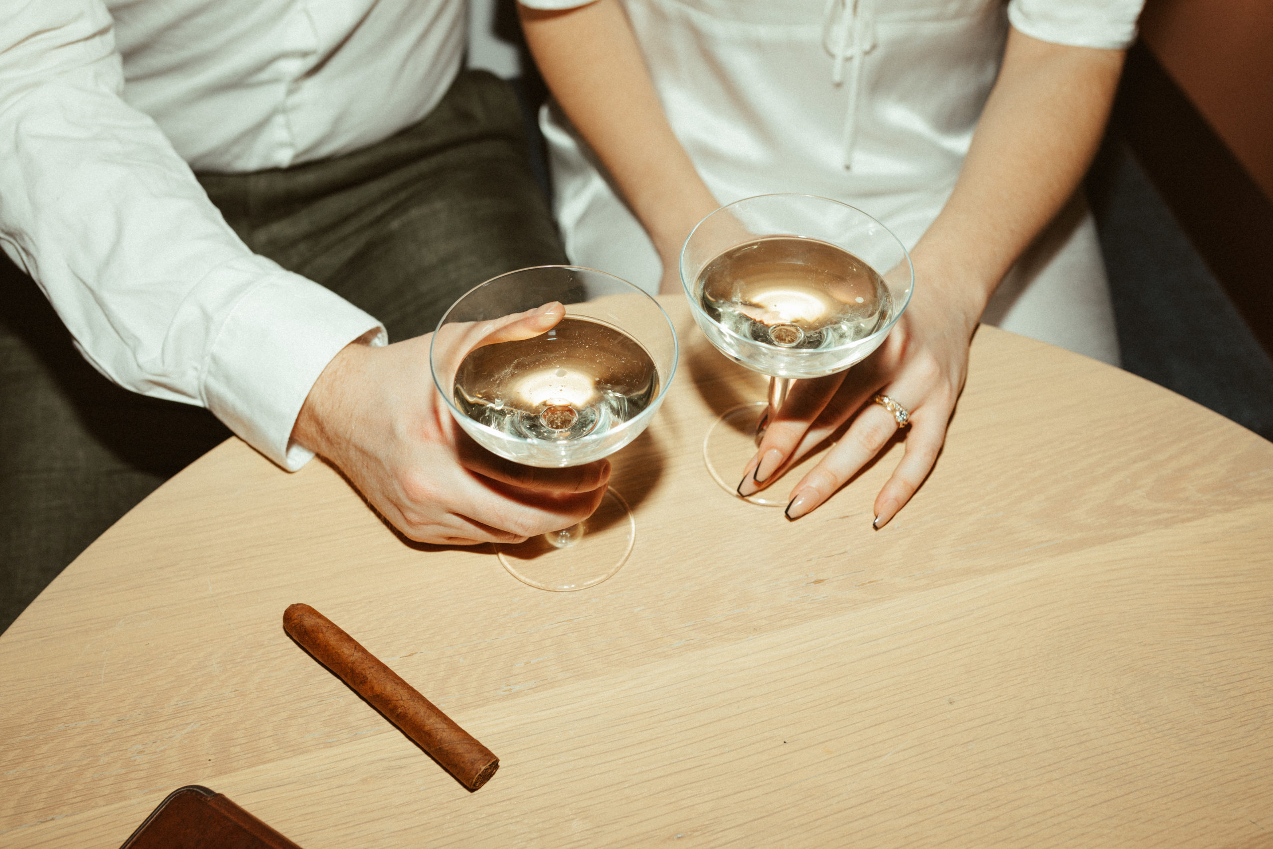 Couple holding a champagne glass at andaz hotel ottawa